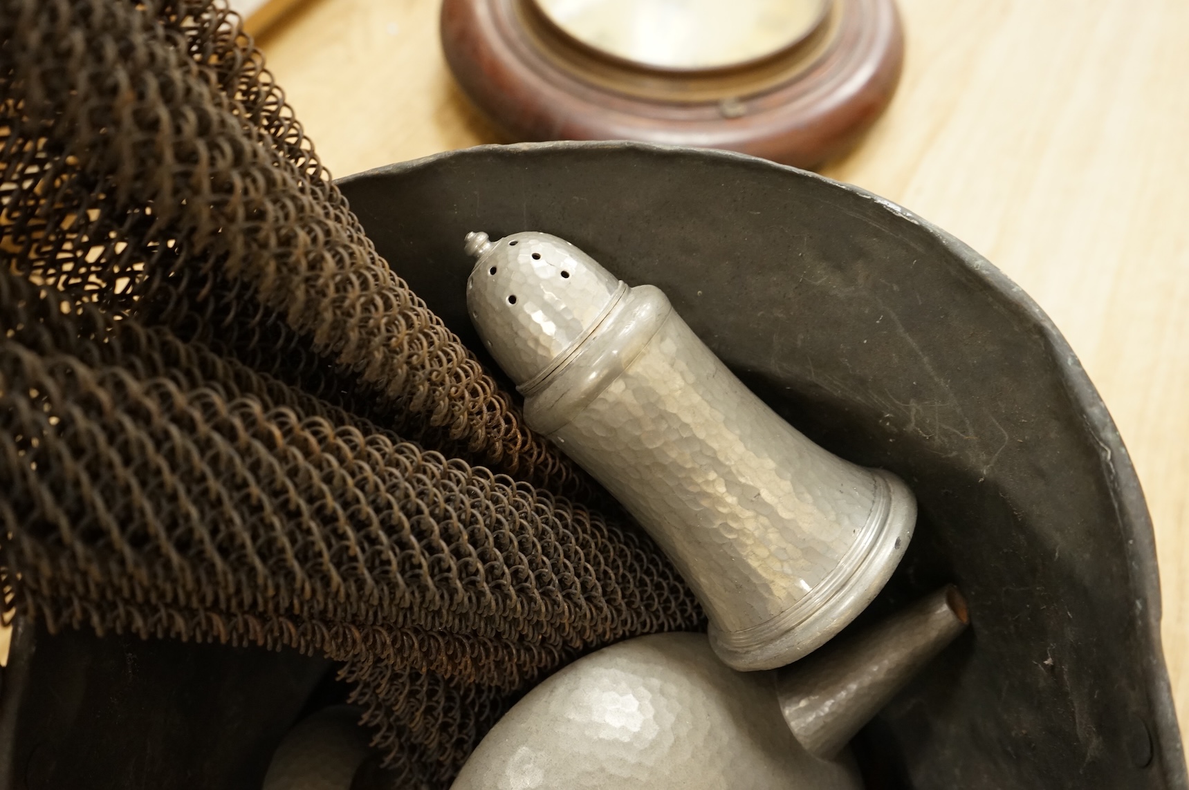 A Hutton, Sheffield English Pewter tea set comprising a teapot, 8cm high, jug and sugar bowl, together with salt and pepper shakers by other makers, a copper coal scuttle and two American mesh fire screens, coal scuttle